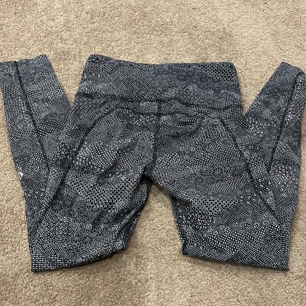Lululemon 26” inseam and un-hemmed.  Size 4. Black/white patterned